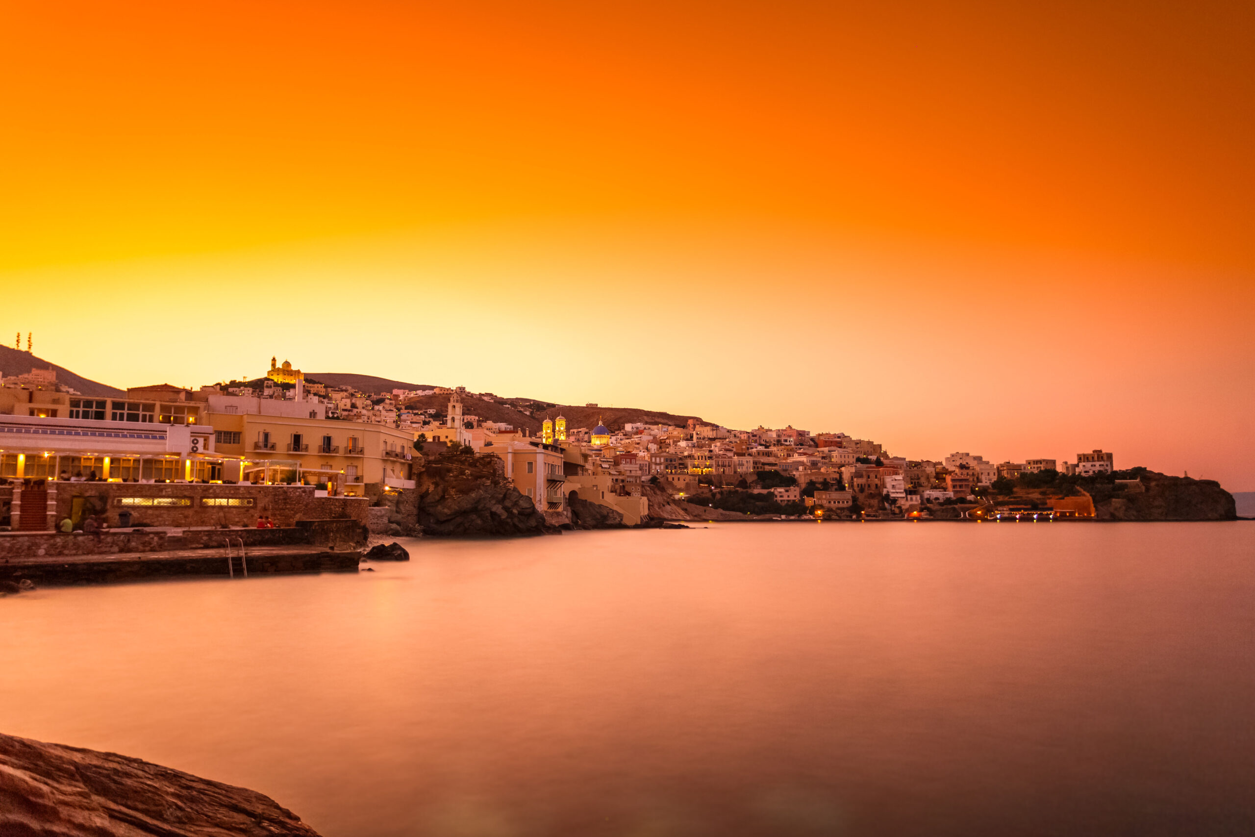 Ermoupolis at Syros island with Vaporia area and traditional houses at dusk or early in the morning before sunrise or sunset, Greece