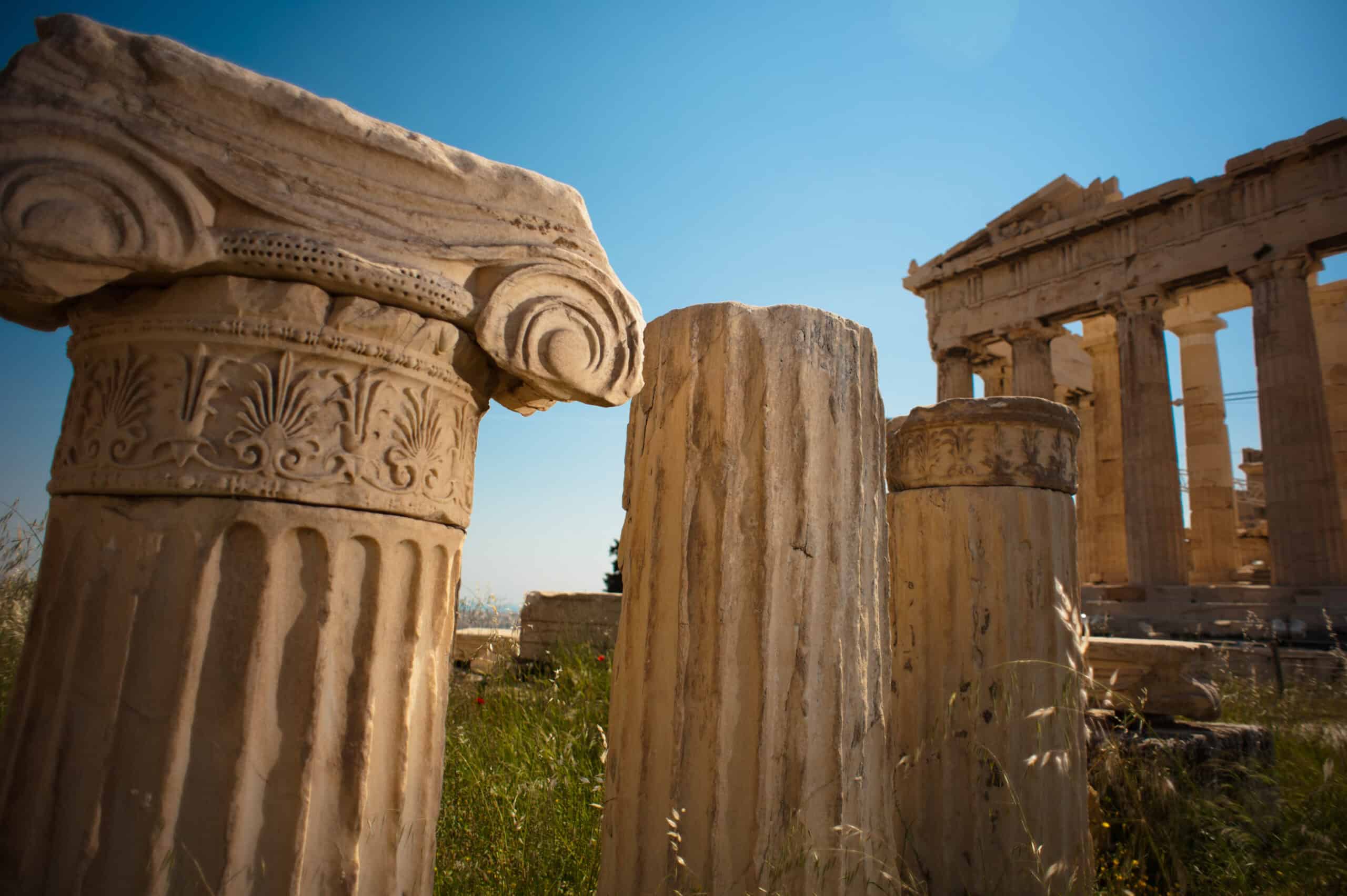 Ionic order fragment against Parthenon, Athenian Acropolis rear facade. Athens, Greece