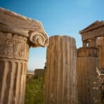 Ionic order fragment against Parthenon Athenian Acropolis rear facade. Athens Greece scaled