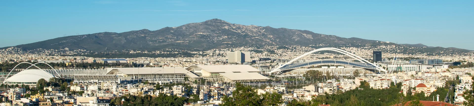 Panoramic view of the north suburbs of Athens City.The Olympic complex facilities at the center of the photo.